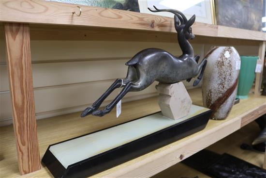I. Rochard. An Art Deco bronze figure of an antelope, on marble base, signed length 56cm